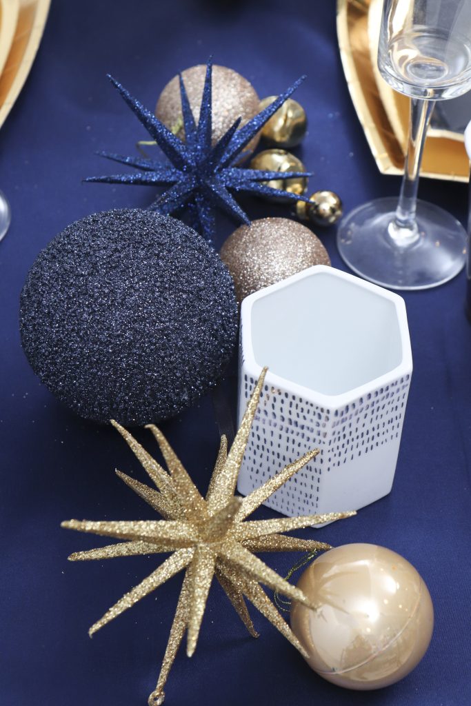 navy and gold holiday table setting 