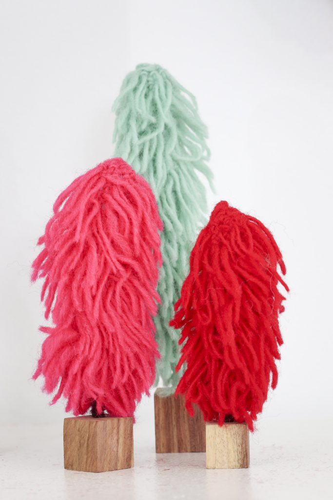 Pom Pom Party for the Holidays mantel decor yarn trees