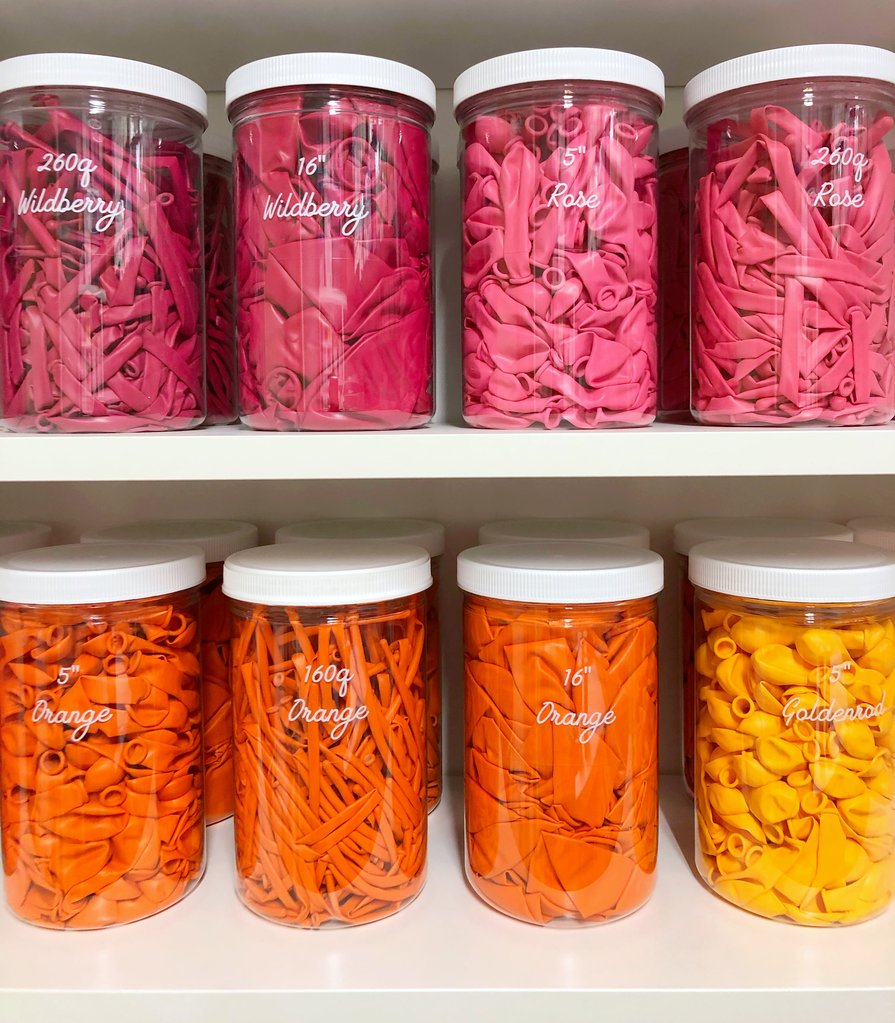 Clear containers are perfect for organizing party supplies - get more organization ideas now at fernandmaple.com!