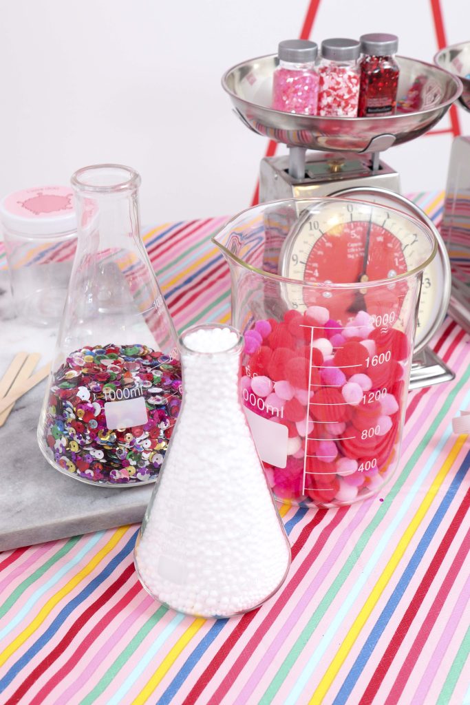 Set up a heart-filled Slime Lab for a fun and entertaining Valentine's Day Slime Party for Kids! Plus, how to create to-go Slime Kits for friends! Get details now at fernandmaple.com!