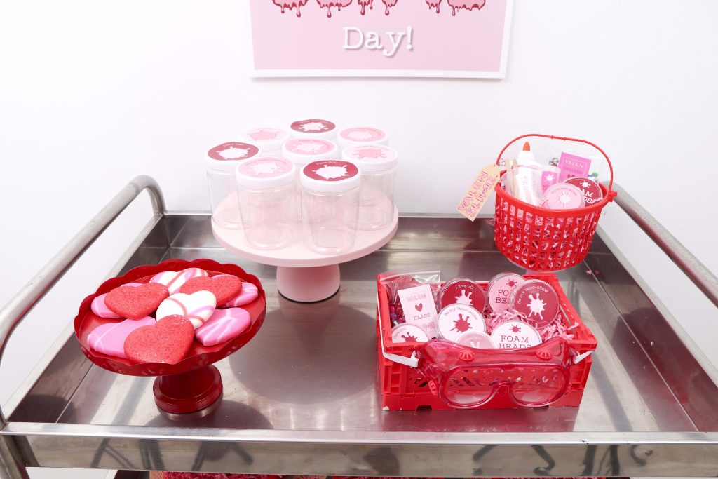 Set up a heart-filled Slime Lab for a fun and entertaining Valentine's Day Slime Party for Kids! Plus, how to create to-go Slime Kits for friends! Get details now at fernandmaple.com!