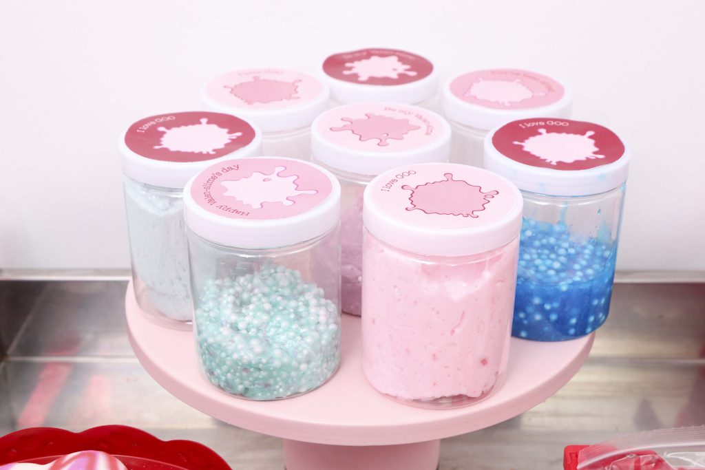 Set up a heart-filled Slime Lab for a fun and entertaining Valentine's Day Slime Party for Kids! Plus, how to create to-go Slime Kits for friends! Get details now at fernandmaple.com!