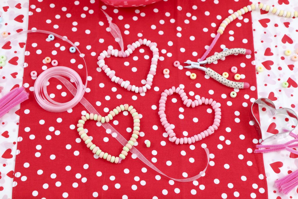 Valentine's Day Candy Heart Craft - These fun 15 Valentine's Day Party Ideas for Kids and Teens feature tons of interactive activities, decor inspiration, and DIY dessert recipes! See them all now at fernandmaple.com!