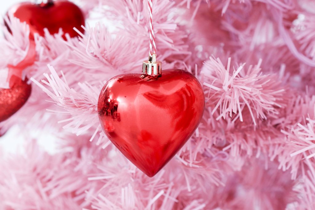 Valentine's Day tree ornaments- decorate a Valentine's Day tree at a tree decorating party with fun backdrop, decor, and candy heart ornament craft! Get details now at fernandmaple.com.