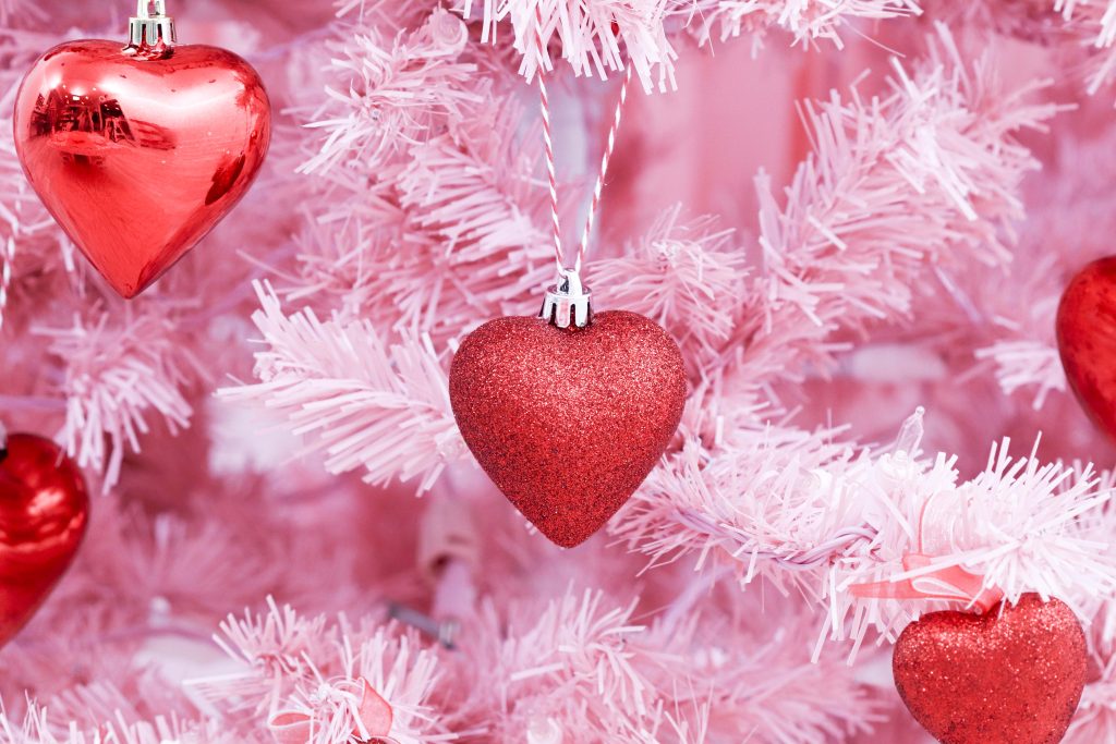 Valentine's Day tree ornaments- decorate a Valentine's Day tree at a tree decorating party with fun backdrop, decor, and candy heart ornament craft! Get details now at fernandmaple.com.