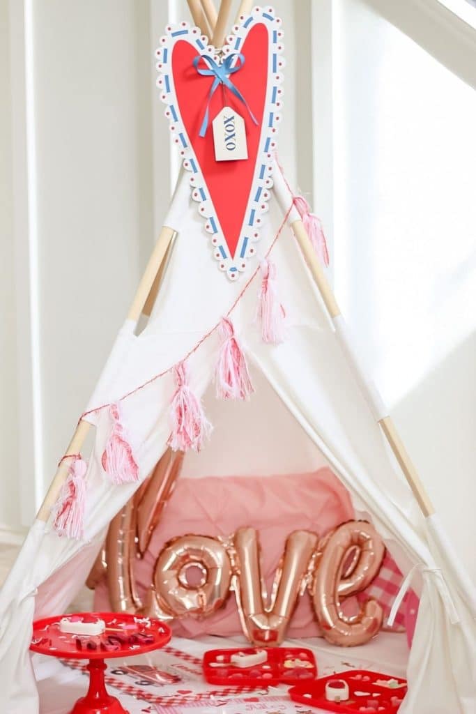 Surprise Snack Tent Party - Valentine's Day Cookie Party - These fun 15 Valentine's Day Party Ideas for Kids and Teens feature tons of interactive activities, decor inspiration, and DIY dessert recipes! See them all now at fernandmaple.com!