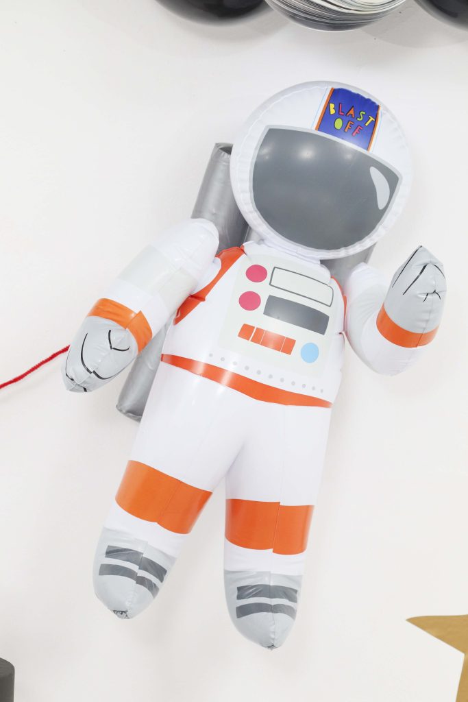 Space Party Astronaut Decor - Looking to throw a Space or Rocket themed birthday? Check out this game-changing “party in a box” recommendation as well as tips for personalizing the party! Get details now at fernandmaple.com.