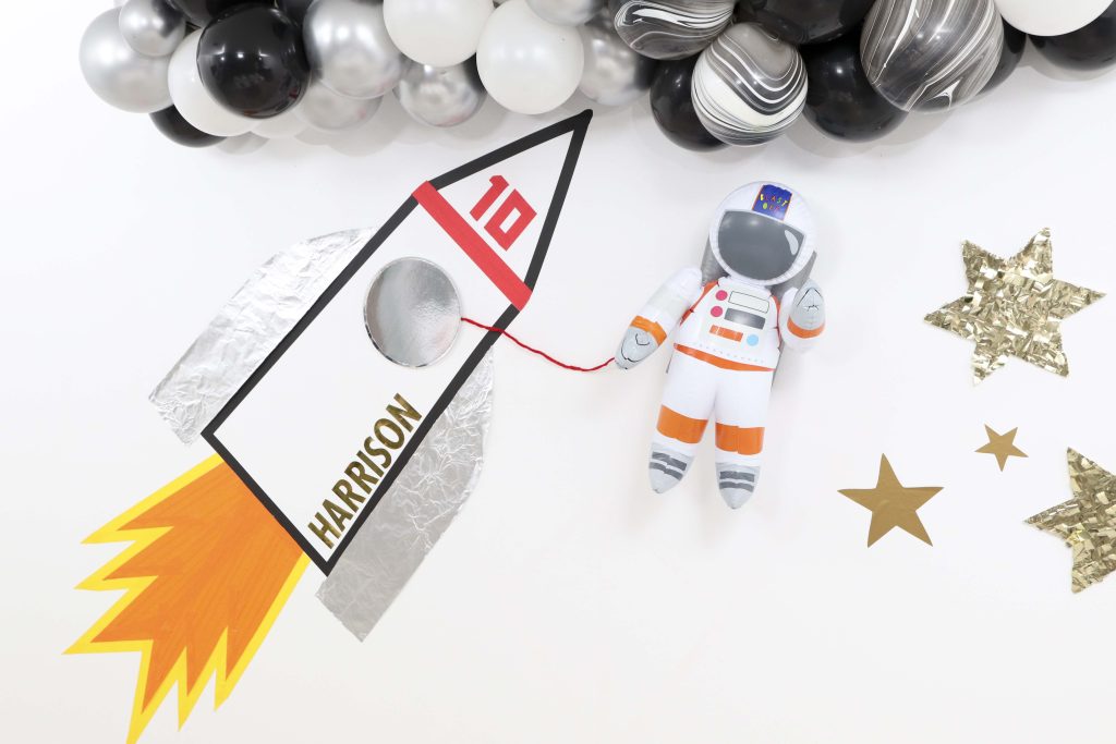 Space Party DIY Backdrop - Looking to throw a Space or Rocket themed birthday? Check out this game-changing “party in a box” recommendation as well as tips for personalizing the party! Get details now at fernandmaple.com.