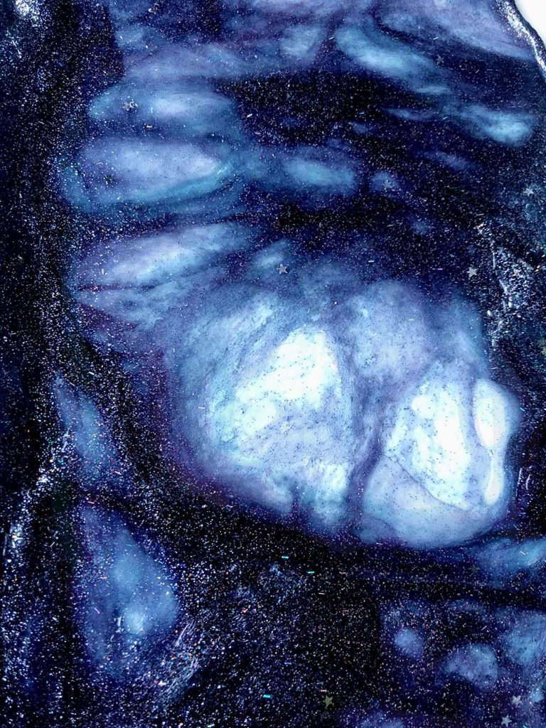 DIY Space Slime - get more space-themed craft ideas now at fernandmaple.com!