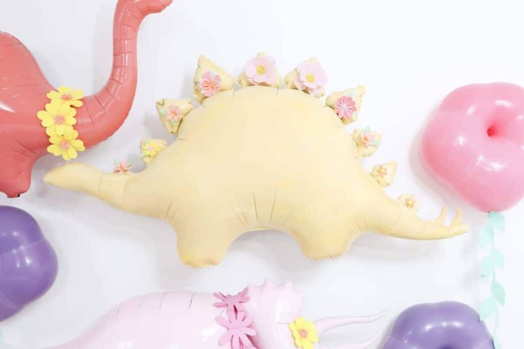 DIY Pastel Spring Dinosaur and Floral Backdrop - get more Spring Dinosaur Party inspiration at fernandmaple.com!