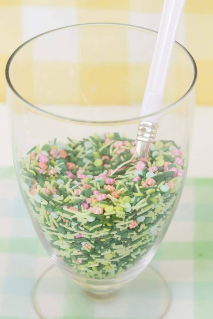 Jar of Spring sprinkles for a Spring Gingerbread House decorating party - get more Spring Party inspiration now at fernandmaple.com!