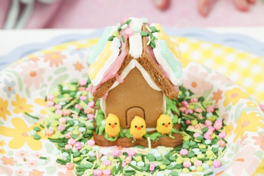 Decorated Spring Gingerbread house from a Spring Gingerbread House decorating party - get more Spring Party inspiration now at fernandmaple.com!