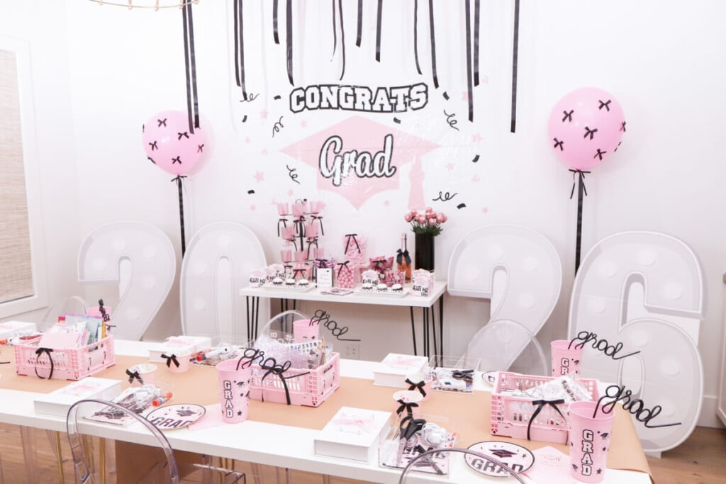 graduation party memory box craft station with pink crates of supplies and individual acrylic trays]