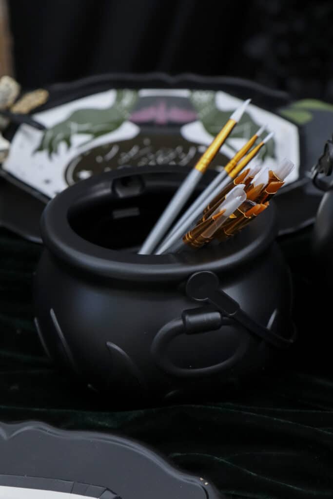 Supply cauldrons for a gothic paint and sip party