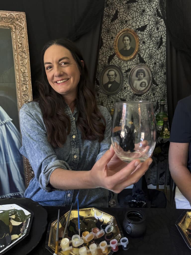 Finished hand-painted wine glasses from a gothic paint and sip party - ready to cure!