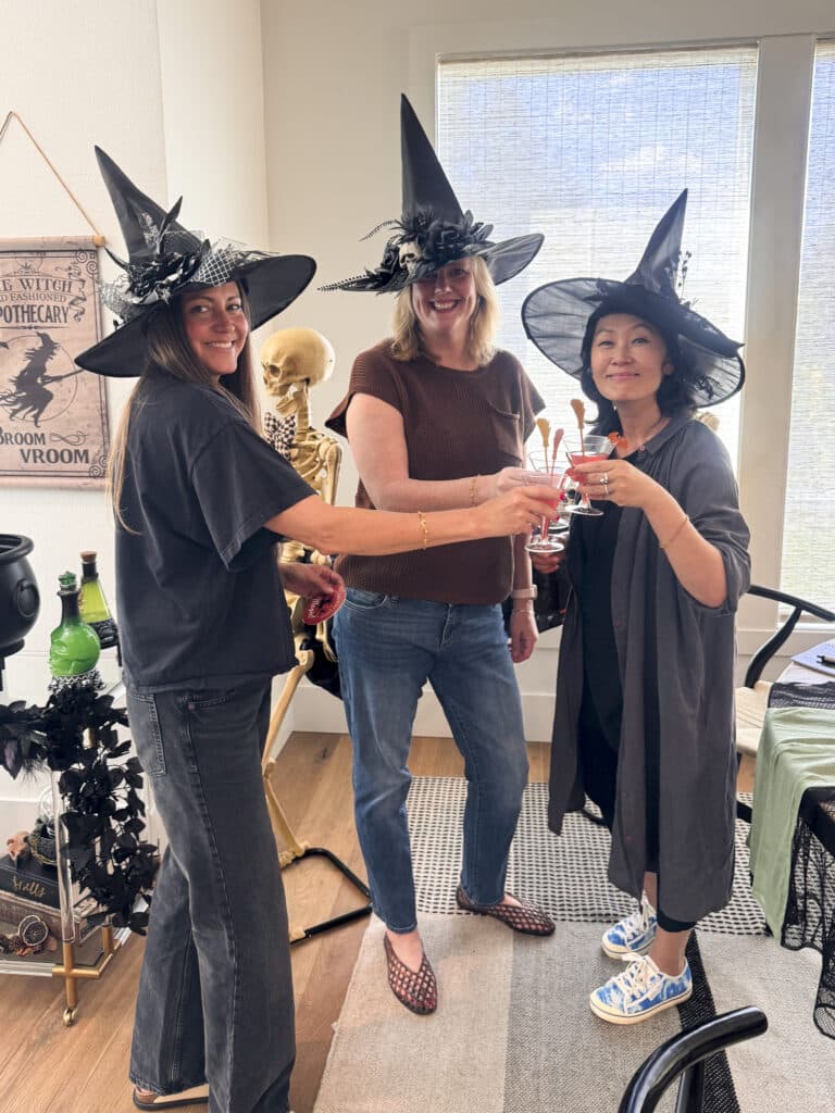 witches toasting at a practical magic inspired potion bar
