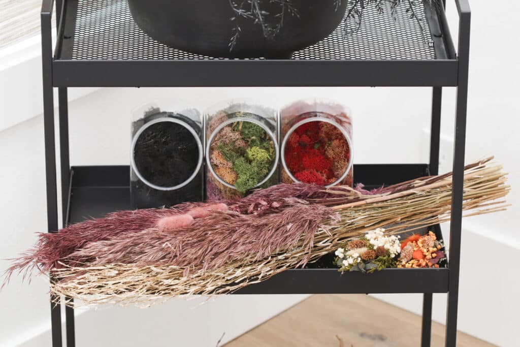 DIY Broom making supplies that give texture. Dried grasses, florals and moss in different colors