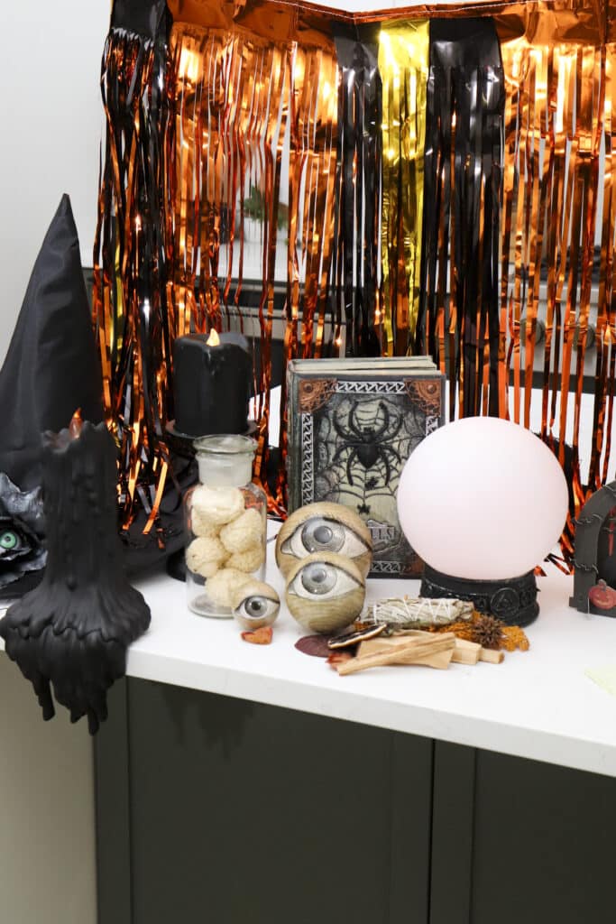 atmospheric styling details for a witch themed dessert bar