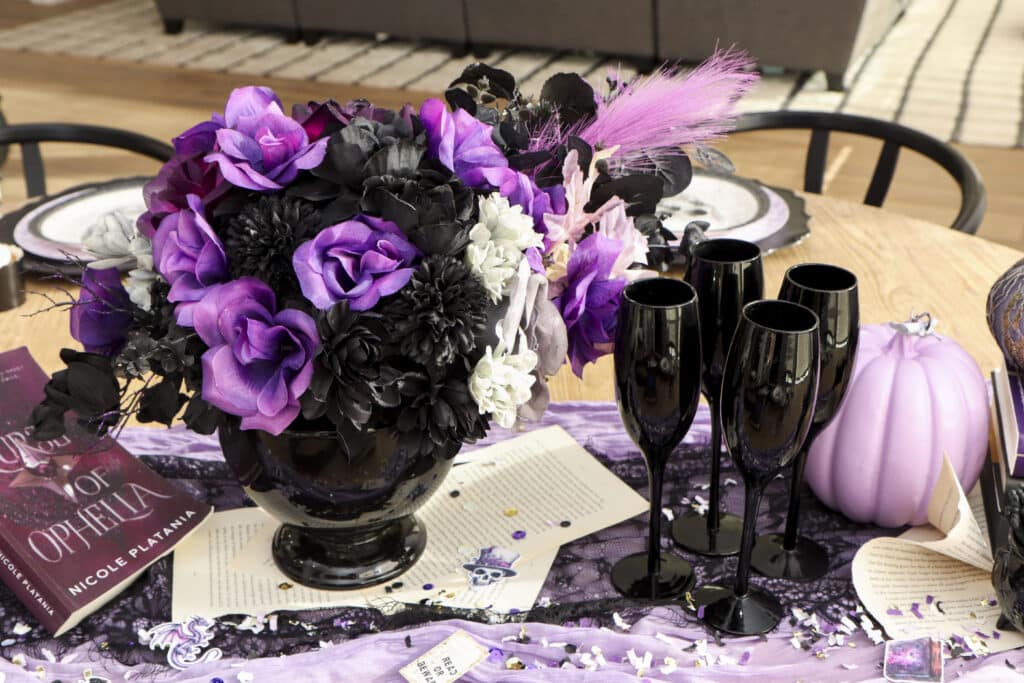 Table runner and floral centerpiece for dark romantasy book club