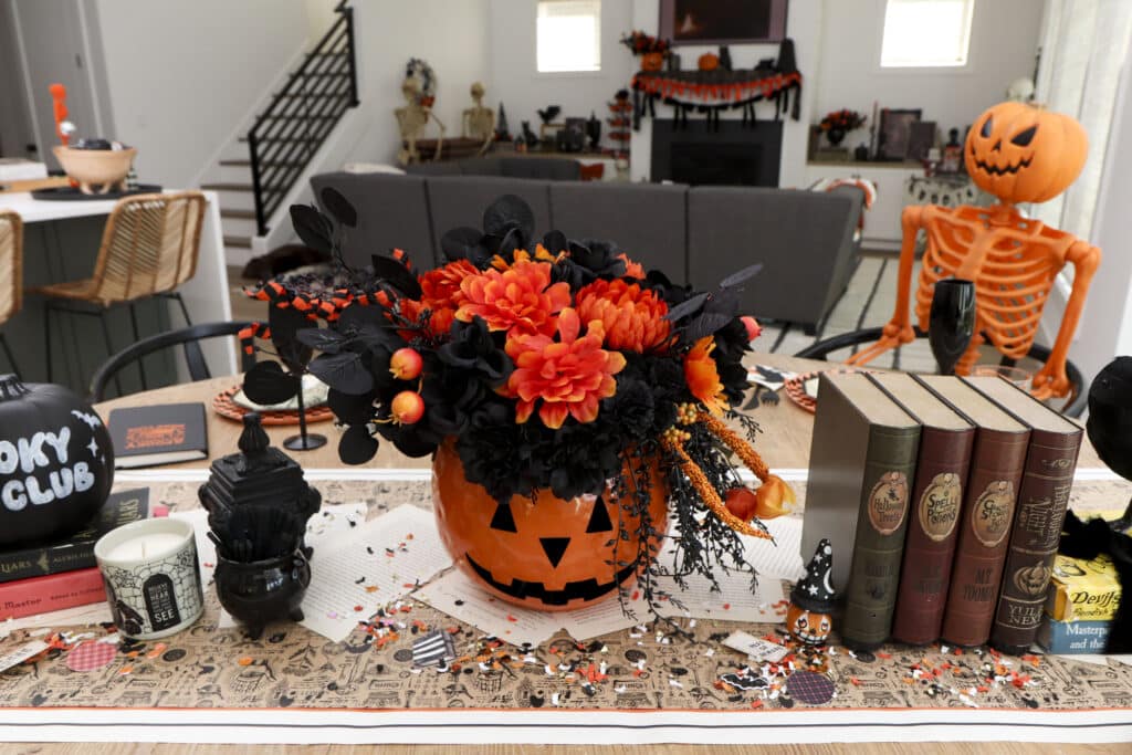 Spooky book club dining table jack-o'-lantern & book centerpiece