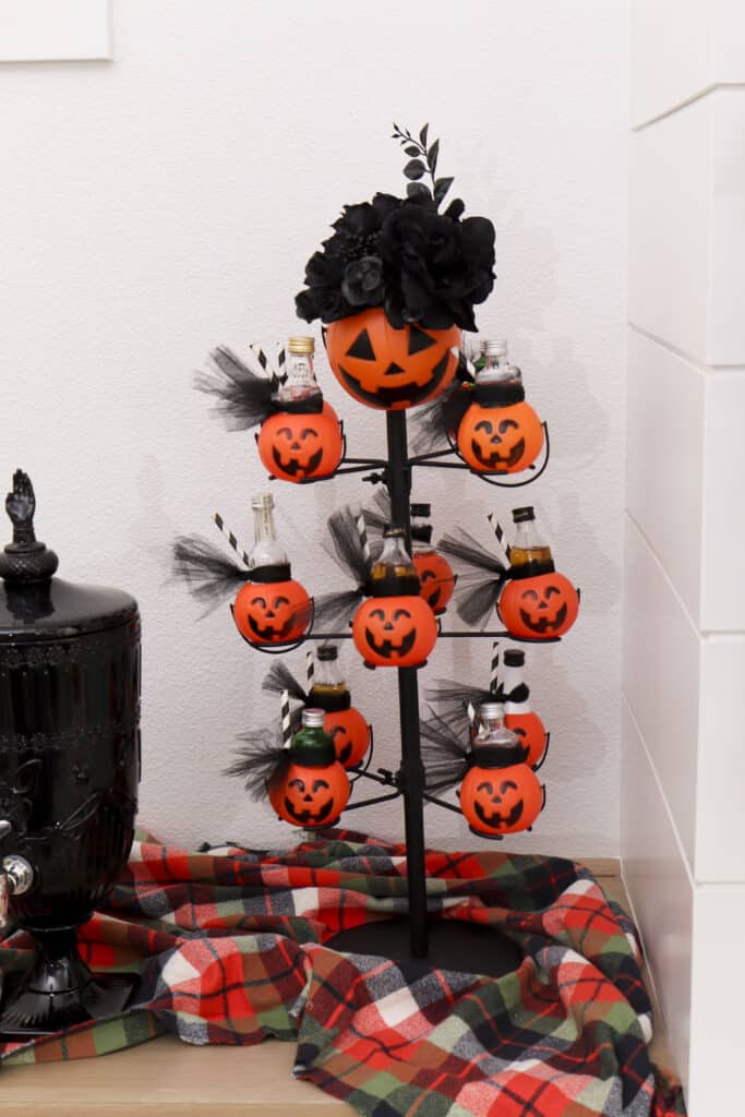 Spooky book club boozy drink stand with Jack-O'-Lantern Tower